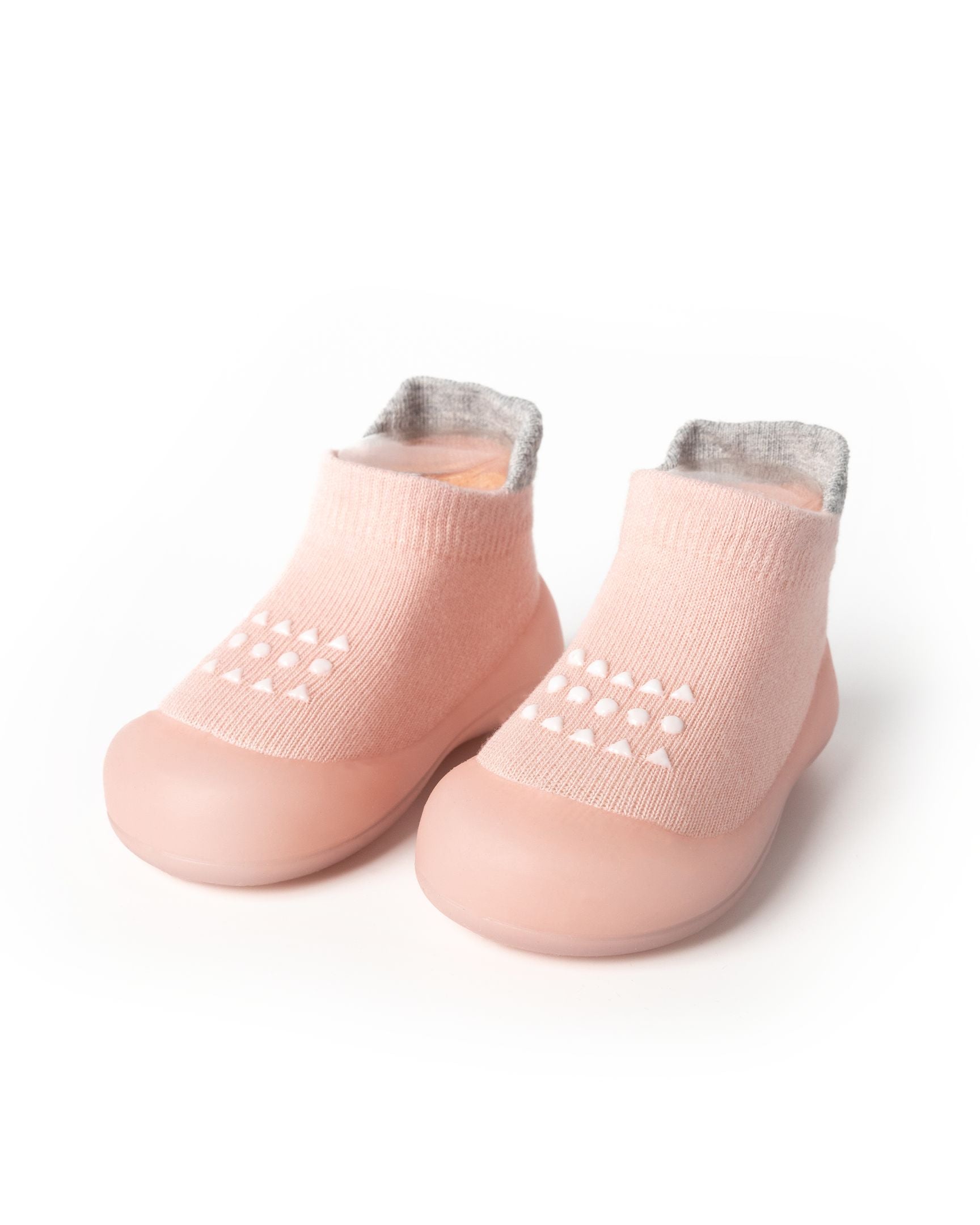 Lyserøde nybegynder sko til baby med skridsikker sål og komfortabel pasform.